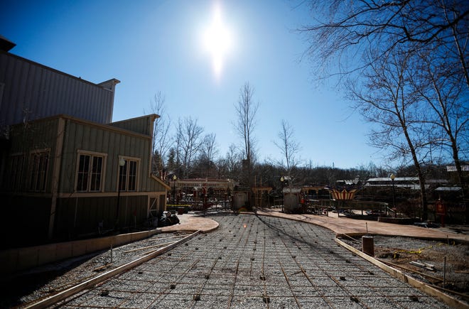 A new concrete walkway from Fireman's Landing at Silver Dollar City connects to the second-generation Fire In The Hole roller coaster.