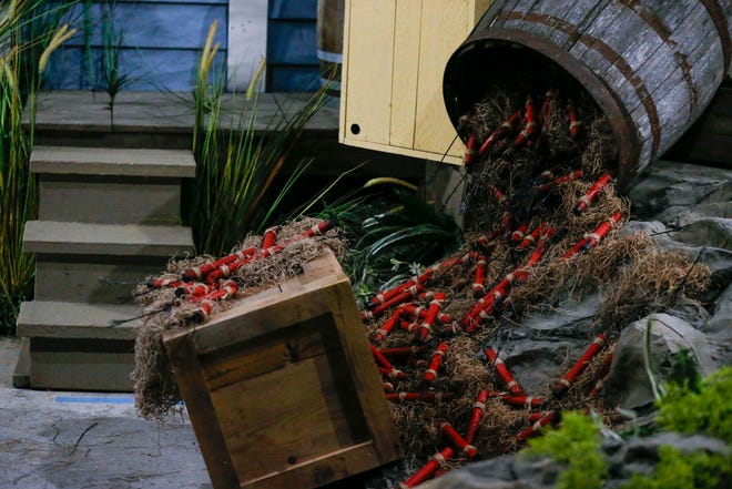 A spilled bucket of prop dynamite insides Silver Dollar City's second-generation Fire In The Hole roller coaster that is slated to open in March.