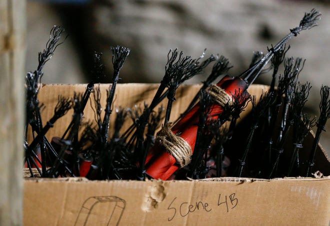 A cardboard box full of prop dynamite waiting to be placed near the near "Kinney Bridge" in Silver Dollar City's second-generation Fire In The Hole roller coaster that is slated to open in March.