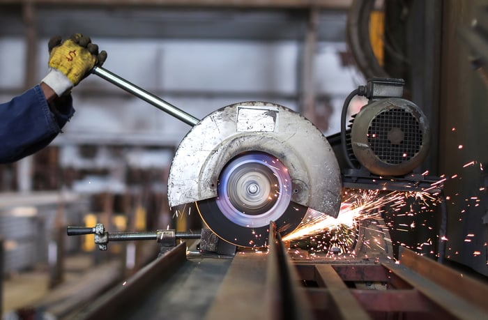 Sparks fly from a circular saw. 