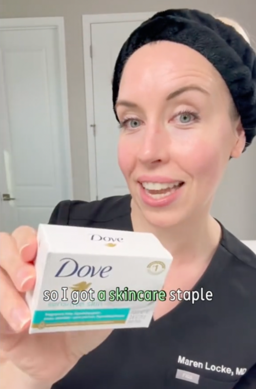 Dermatologist Maren Locke holds up a skincare product from Dollar Tree