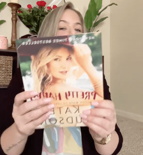 Female shopping influencer at home showing products from Dollar Tree