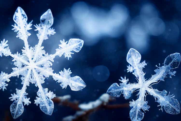 Beautiful snow flake crystal with snow background