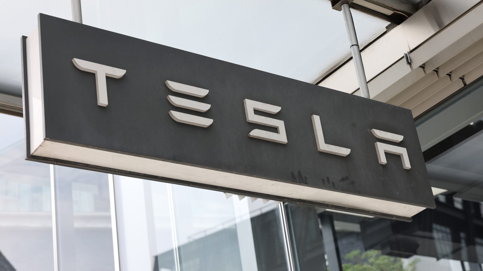 Tesla signage is seen at a Tesla showroom on July 05, 2024 in New York City. 