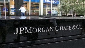 A photo of a J.P. Morgan Chase & Co (JPM) sign outside a building in a city.