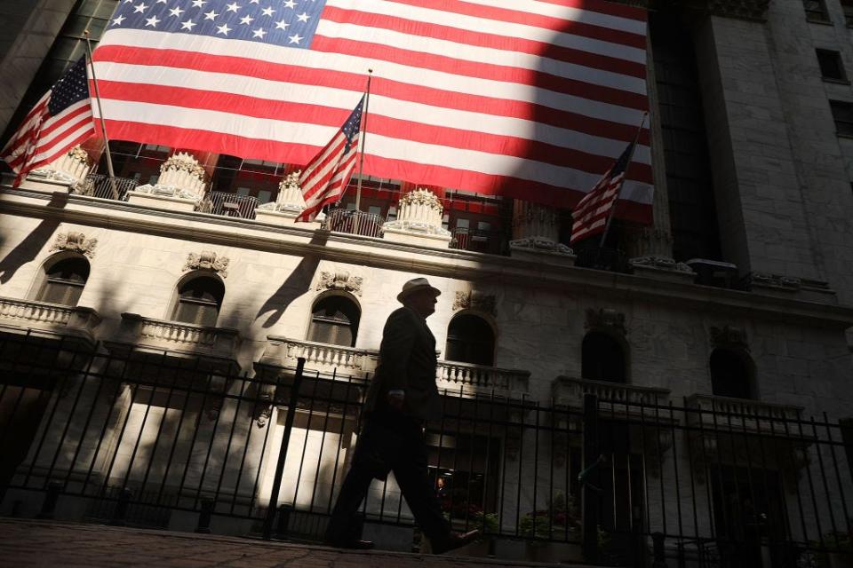 Man walks by NYSE in NYC