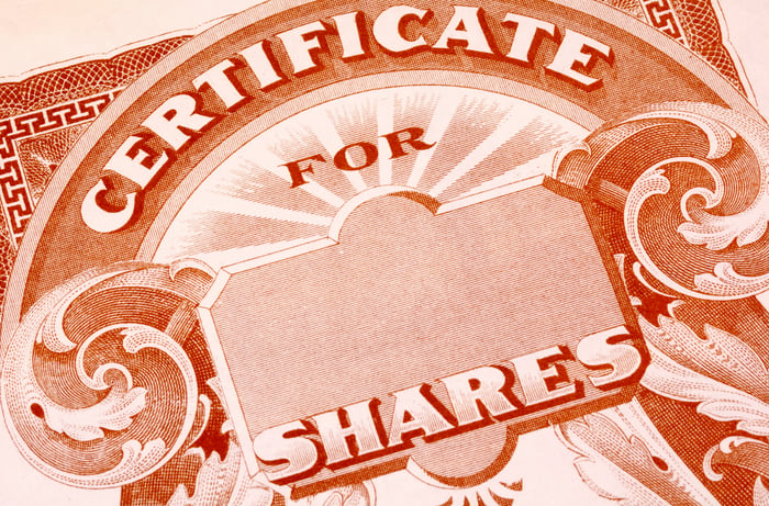 An up-close view of a blank stock certificate for shares of a publicly traded company. 