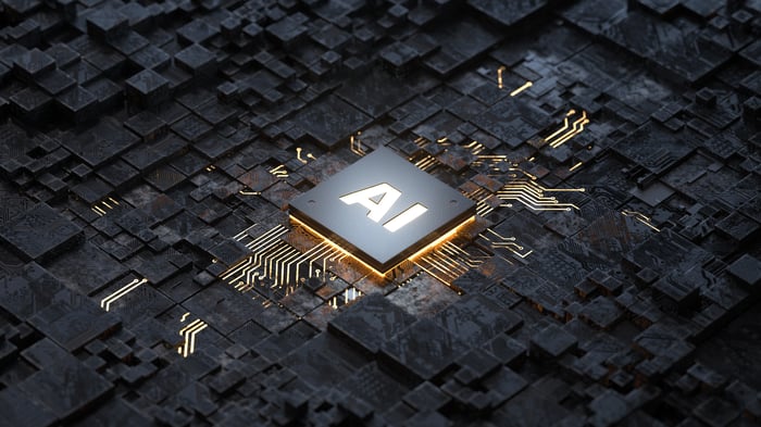 An artificial intelligence chip underlit with gold.