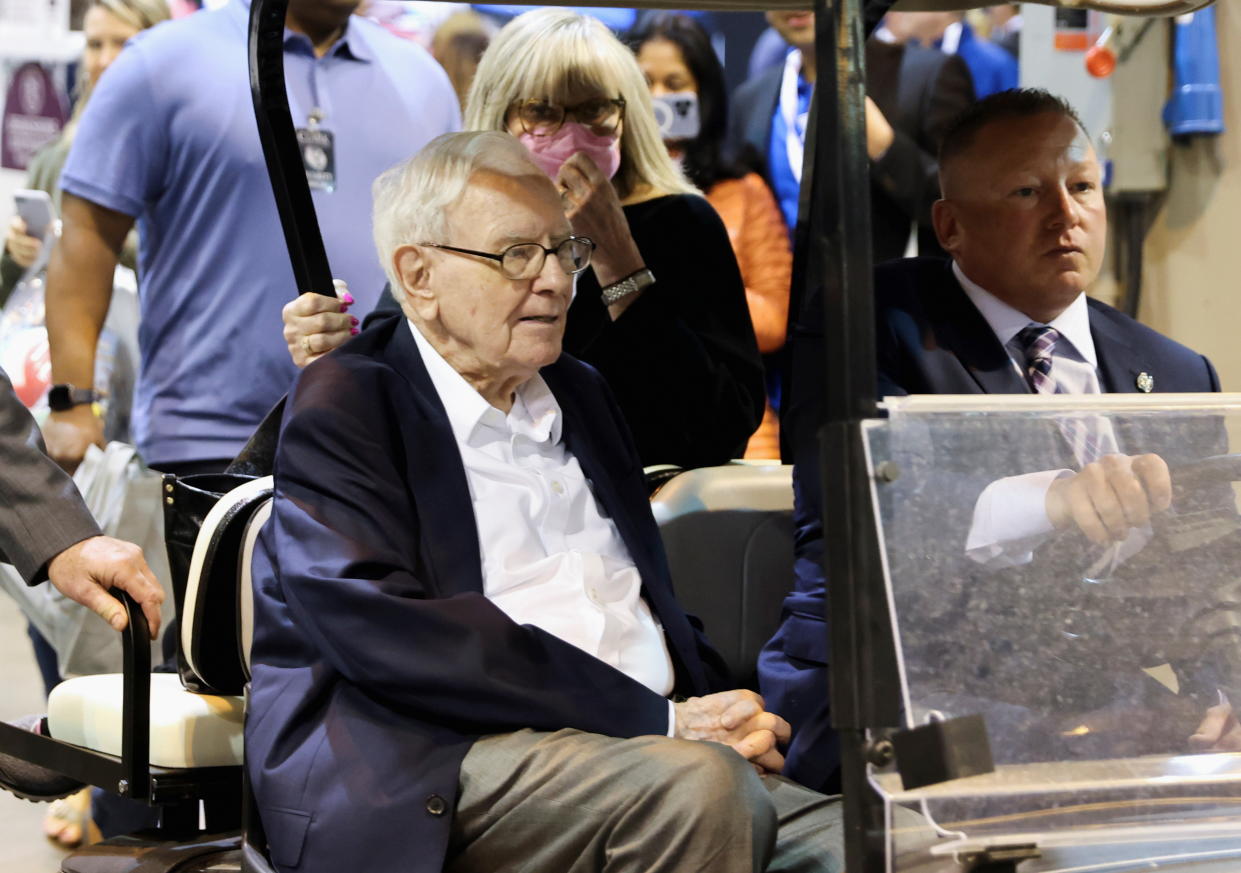 Berkshire Hathaway CEO Warren Buffett rides through the exhibition hall at the company's annual meeting in Omaha, Nebraska, on April 29, 2022.  REUTERS/Scott Morgan