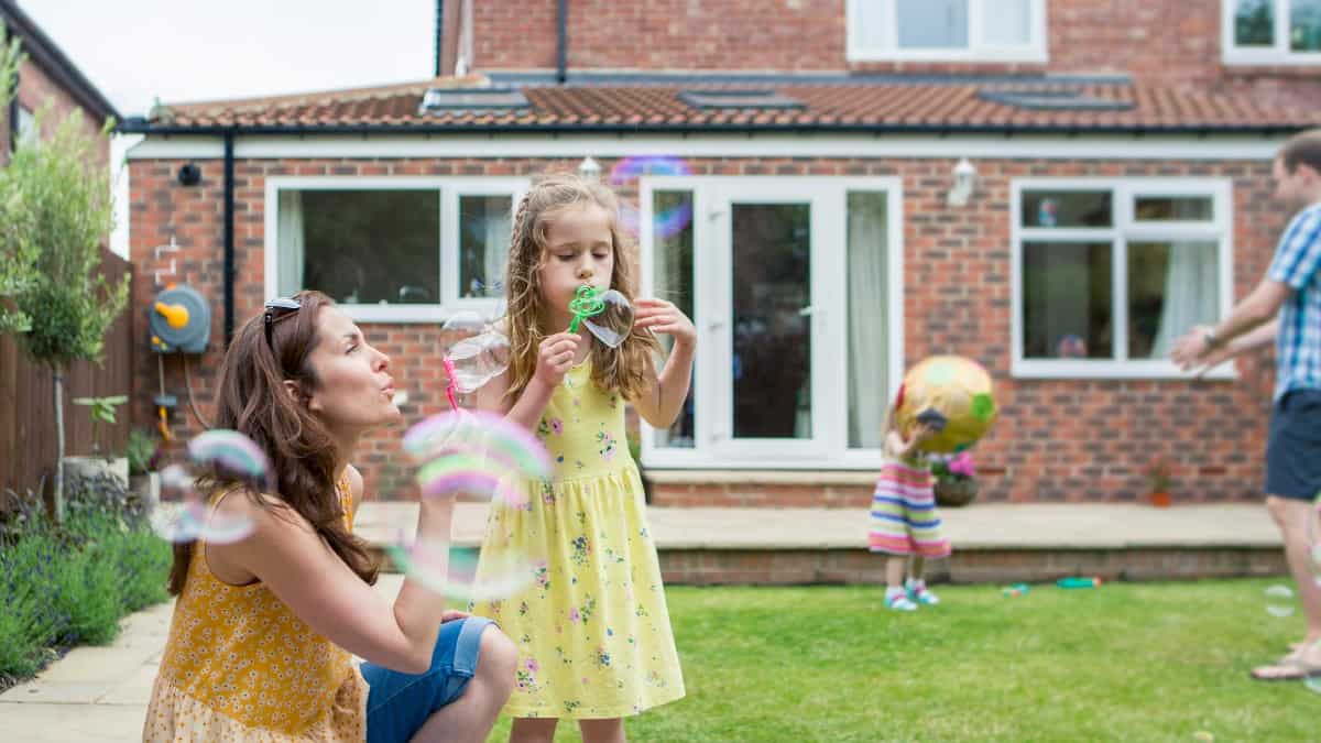 Mother and Daughter Blowing Bubbles