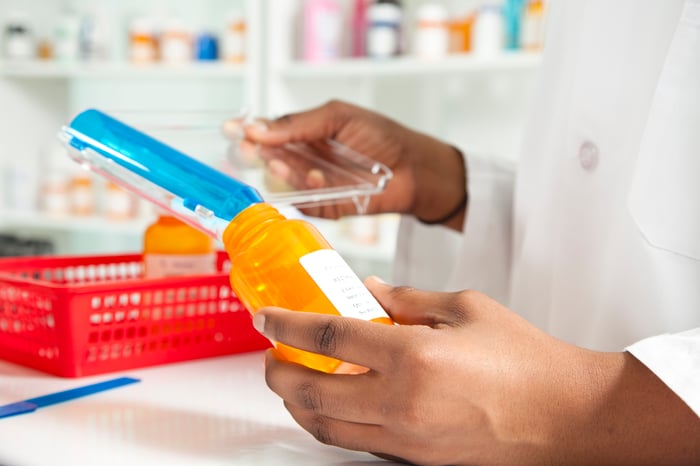 A pharmacist filling a prescription.