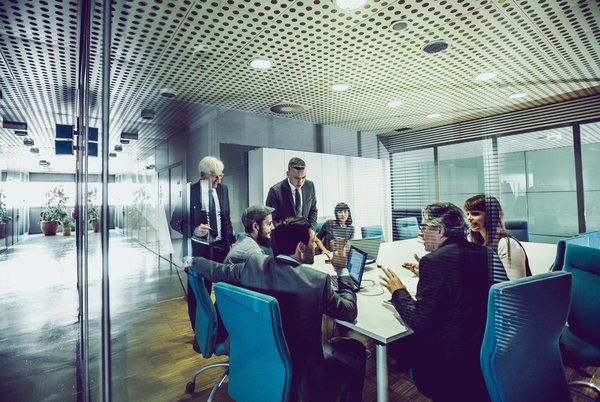 Executives in a conference room for a board of directors meeting.