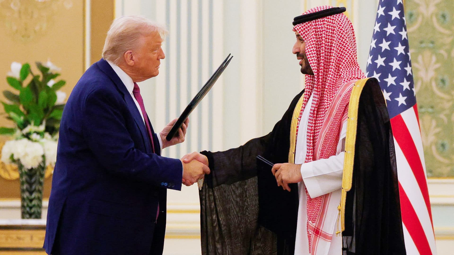 U.S. President Donald Trump and Saudi Crown Prince and Prime Minister Mohammed bin Salman shake hands during a Memorandum of Understanding signing ceremony at the Royal Court in Riyadh, Saudi Arabia, on May 13, 2025.