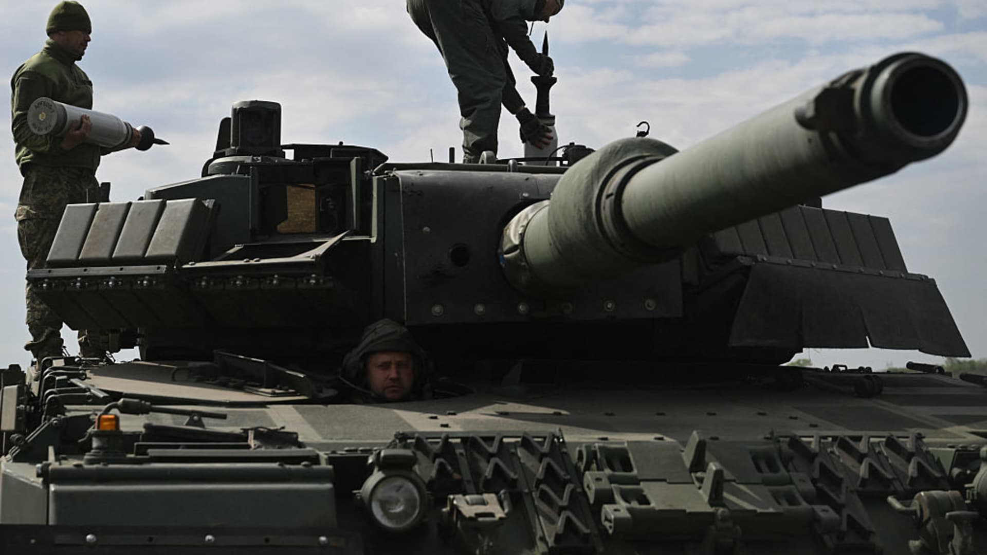 A Ukrainian tank crew of the 33rd Separate Mechanized Brigade load tank ammunition onto a Leopard 2A4 tank during a field training exercise at an undisclosed location in Ukraine, on April 30, 2025. Germany's Renk makes gearboxes for Leopard 2 tanks which have been sent to the country.
