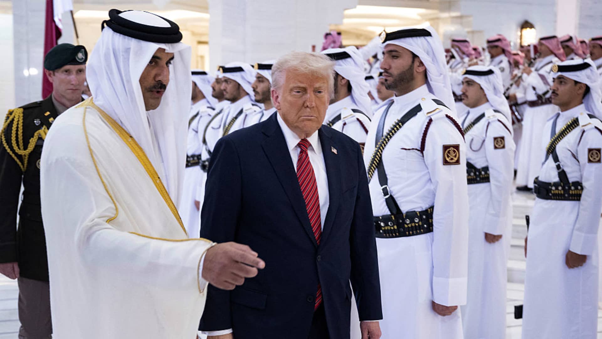 Qatar's Emir Sheikh Tamim bin Hamad al-Thani (L) receives US President Donald Trump in the Qatari capital Doha on May 14, 2025.