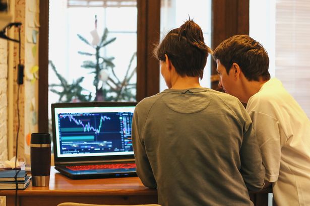 Adult Women With Short Haircut Standing At Home, Learning About Investment Business And Interested About Financial Data Documents