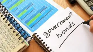 Government bonds written in a note. Trading concept.