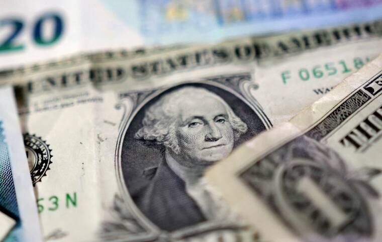 REUTERS/Dado Ruvic/Illustration
Dollar banknotes are seen in this illustration taken May 4.