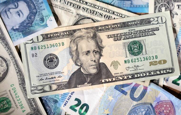 REUTERS/DADO RUVIC/ILLUSTRATION/FILE PHOTO
Dollar, Euro and Pound banknotes are seen in this illustration on May 4. The dollar weakened anew today, weighed down in part by more cautious remarks about the economy by Federal Reserve officials, even as traders looked ahead to upcoming U.S. talks with Japan that could include discussions on currencies as part of a trade deal.