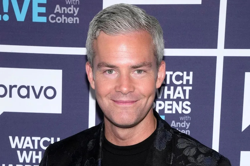 Ryan Serhant smiling at the Watch What Happens Live clubhouse in New York City.