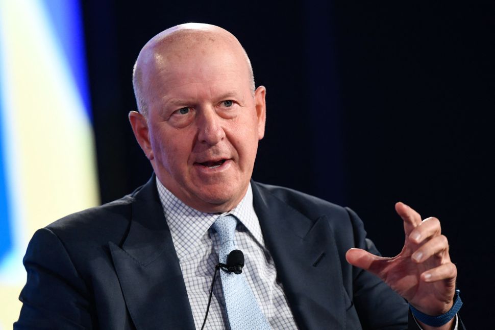 Bald middle-aged white man in suit and tie.