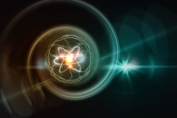 digital image of an atom with a glowing nucleus.