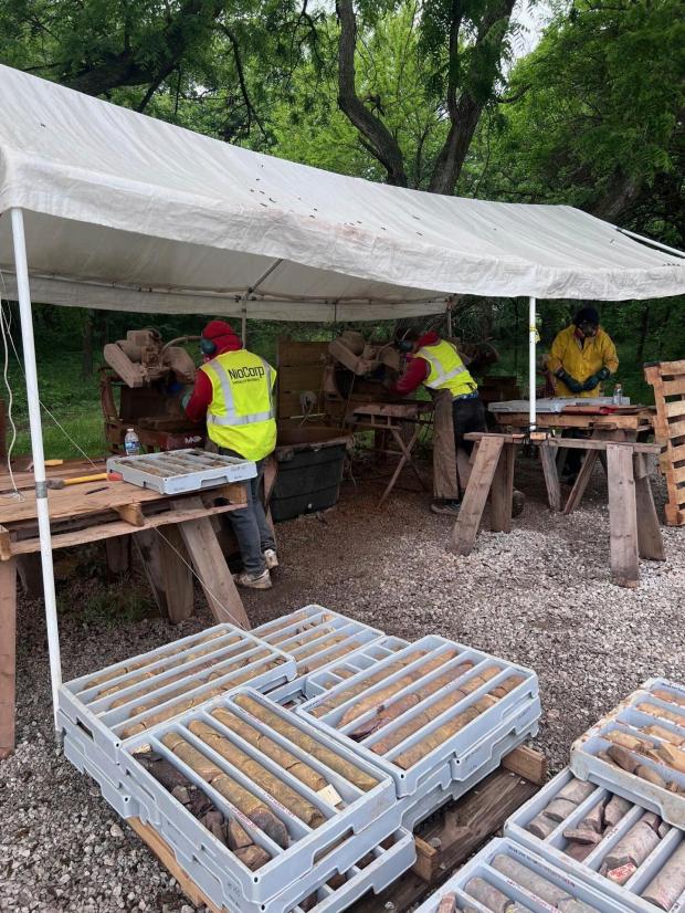 This photo provided by NioCorp shows workers cutting core samples...