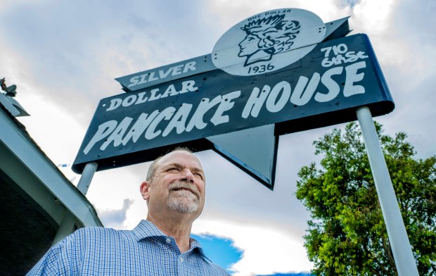 Corona City Councilmember Wes Speake, who is also the president of the Corona Historic Preservation Society, is working to raise funds to restore the Silver Dollar Pancake House's neon sign. Here he stands outside Corona's oldest continuously operating restaurant on Thursday, Sept. 18, 2025. (Photo by Terry Pierson, The Press-Enterprise/SCNG)