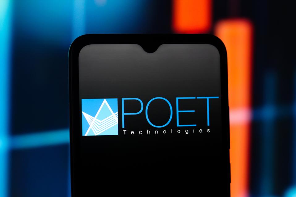 In this photo illustration, the POET Technologies logo is...