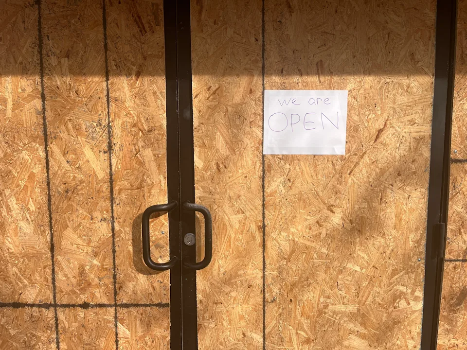 Columbus' Downtown Dollar General store, located at 166 S. High St., is open, despite its windows and doors being boarded up, as seen Oct. 27, 2025. The store manager said the entryways are covered to prevent anticipated looting come Nov. 1, when SNAP benefits end due to the ongoing federal government shutdown.
