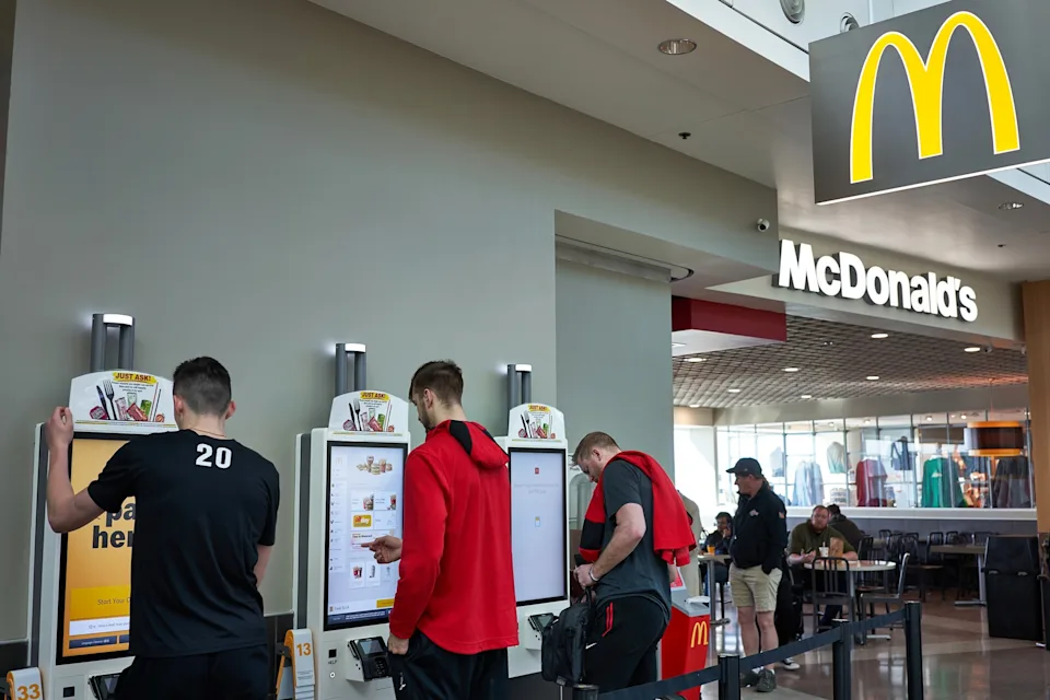 STOCK IMAGE/Getty Images - PHOTO: In this Feb. 23, 2020, file photo, people using the self service kiosks to place their orders at a McDonald's Restaurant in Portland International Airport, in Portland, Oregon.