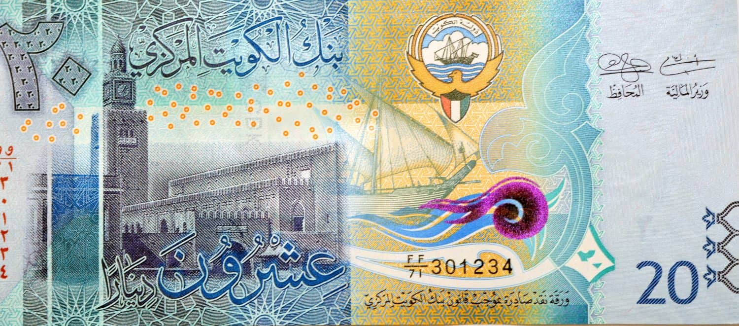 Large fragment of the obverse side of 20 KWD twenty Kuwaiti dinars bill banknote features Seif Palace and a dhow ship, Kuwaiti dinar is the currency of the State of Kuwait, selective focus