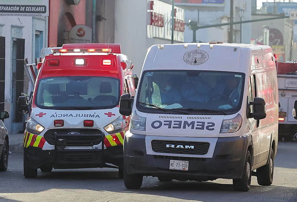Forensic technicians work in the area where a fire inside a store killed multiple people, in Hermosillo, Mexico, November 1, 2025.