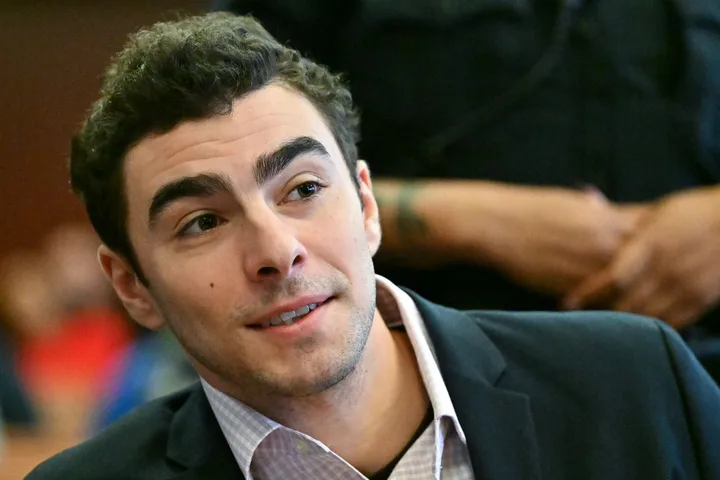 Luigi Mangione chats with a member of his legal team as he is photographed in New York Supreme Court. 