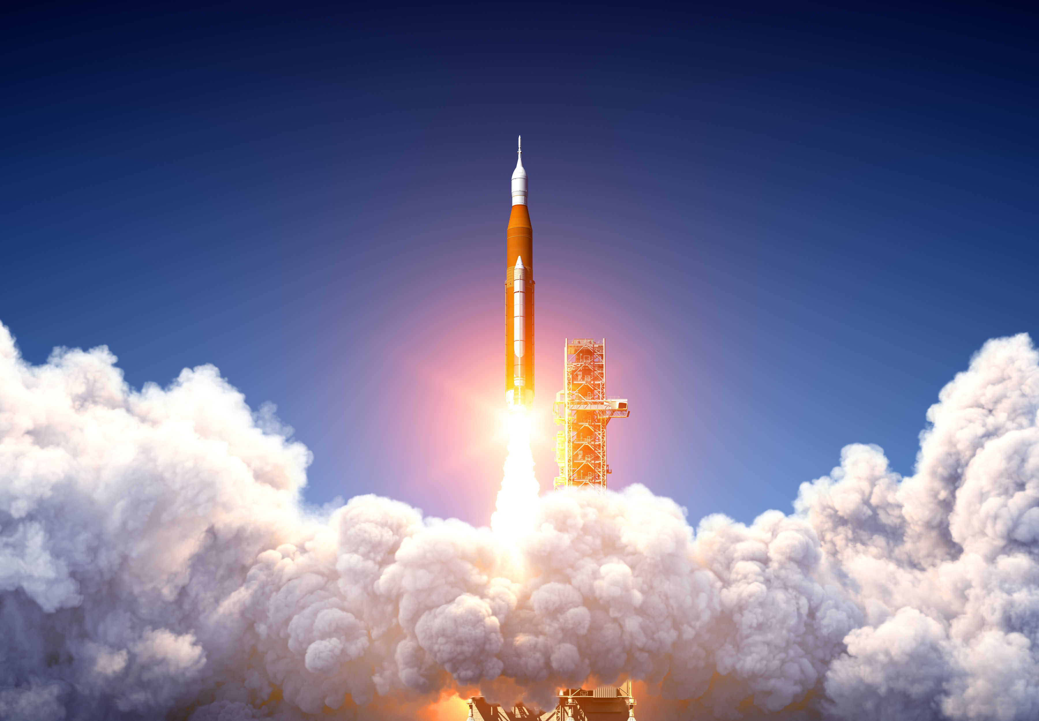 A rocket is lifting off from a launch pad.