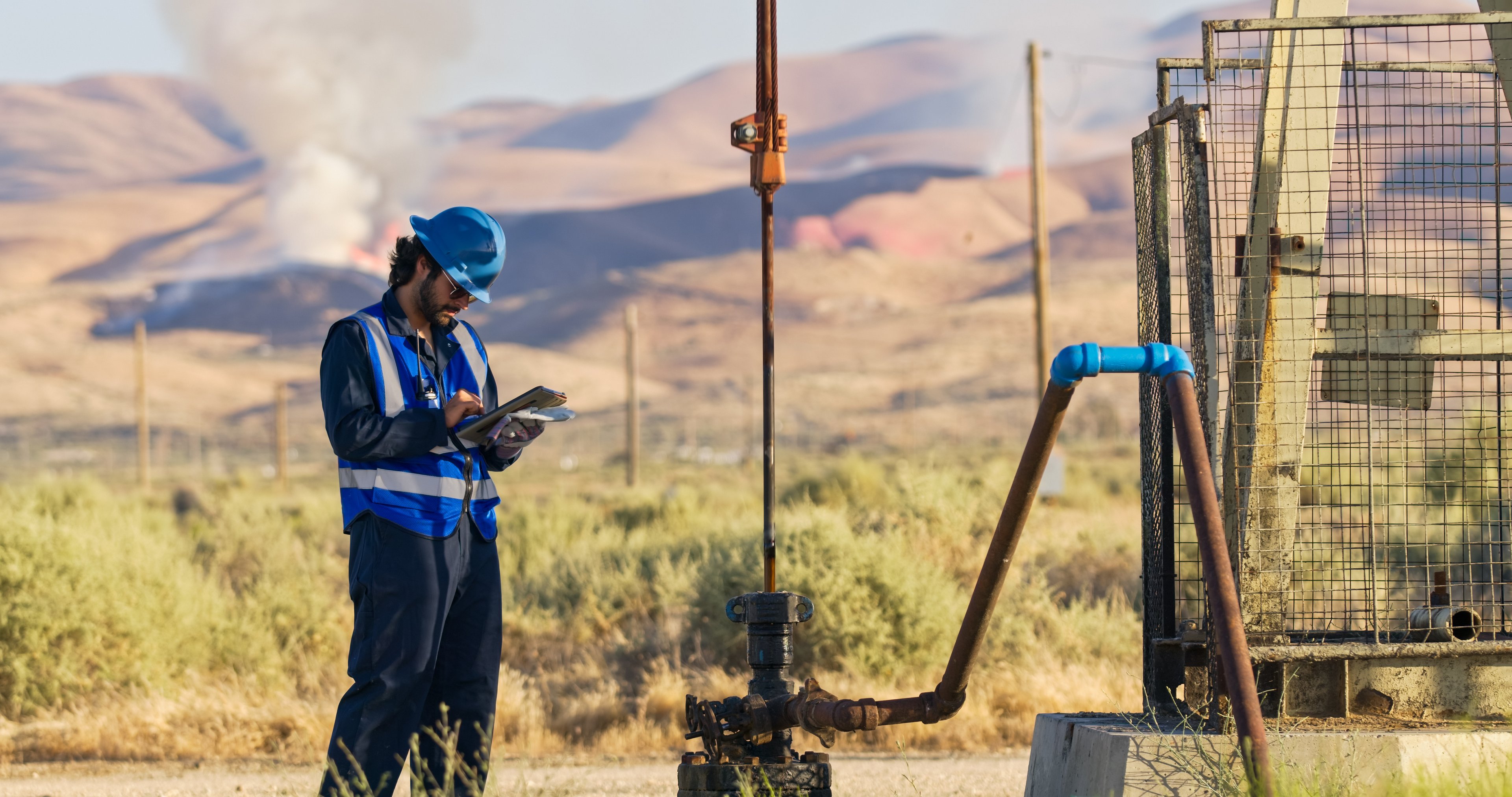 A person operating an oil well.
