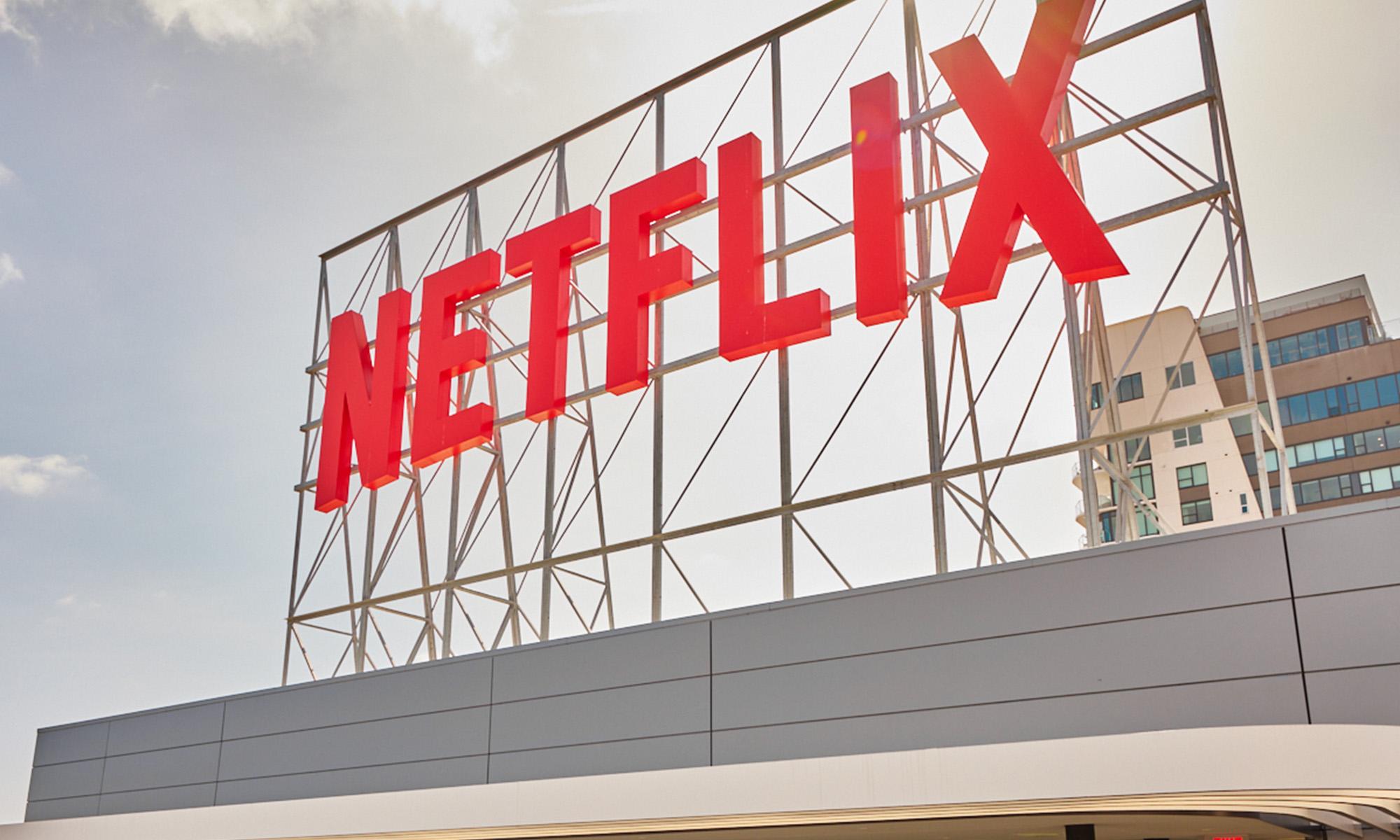 A large Netflix sign on top of a building.