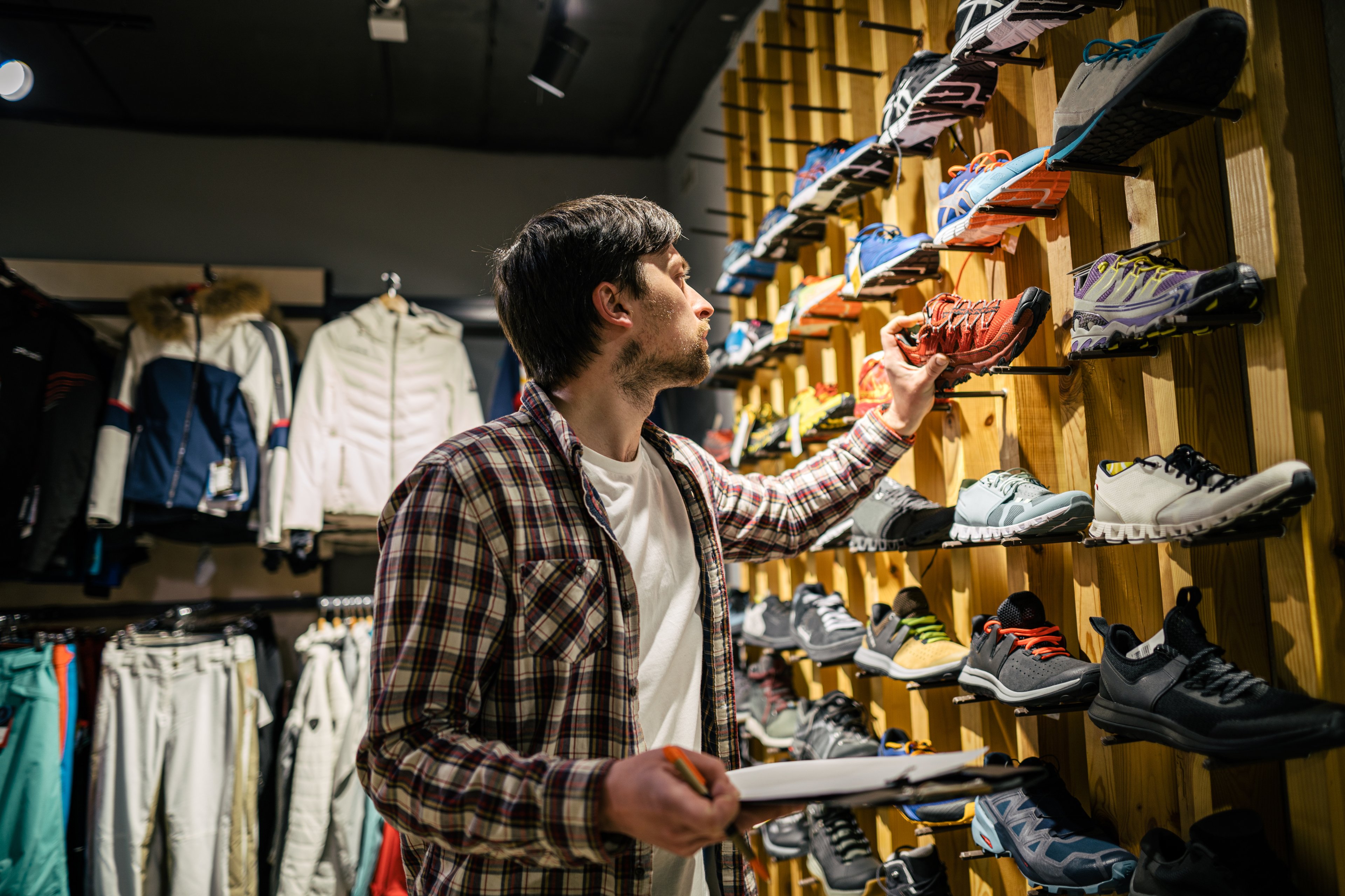 A person shopping for sneakers. 