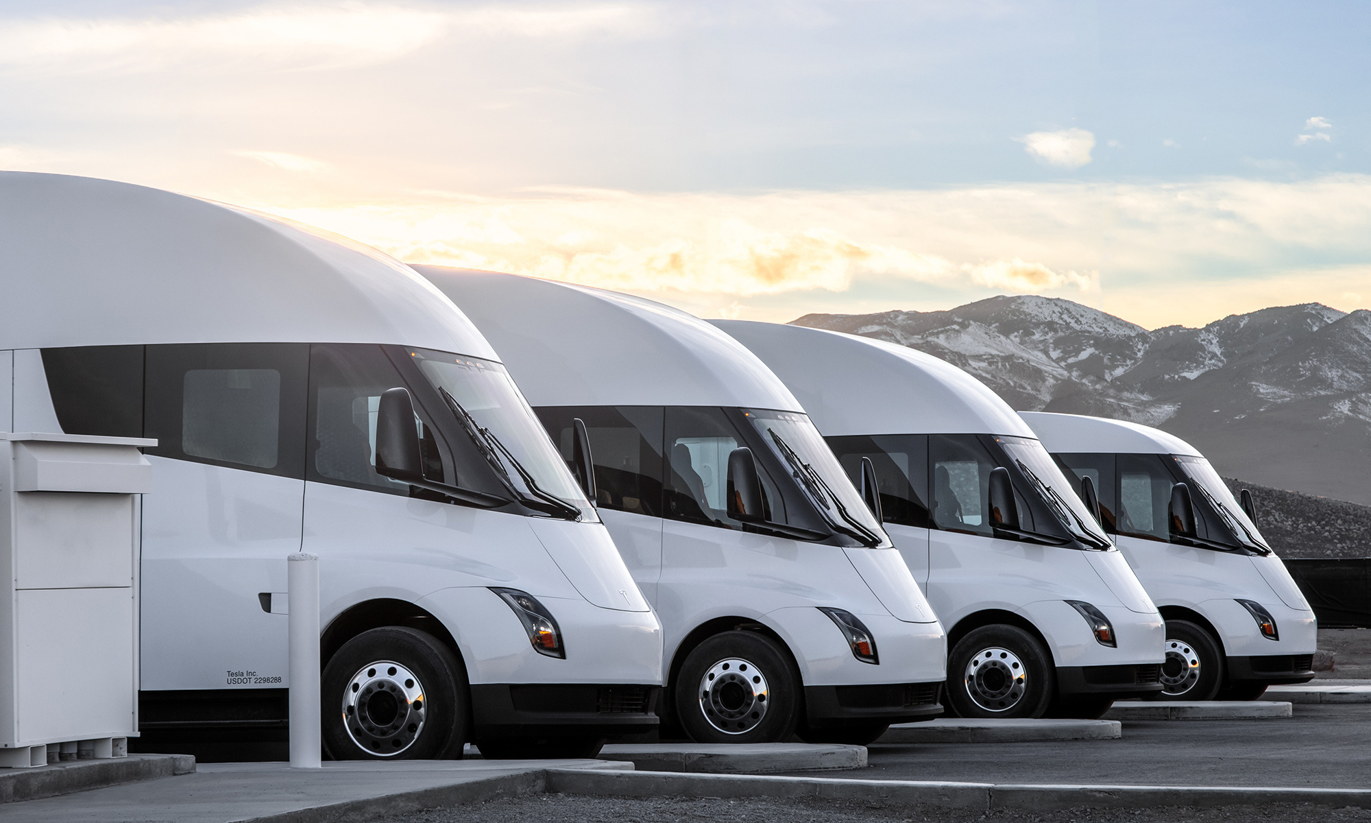 Tesla Semis lined up in a parking lot