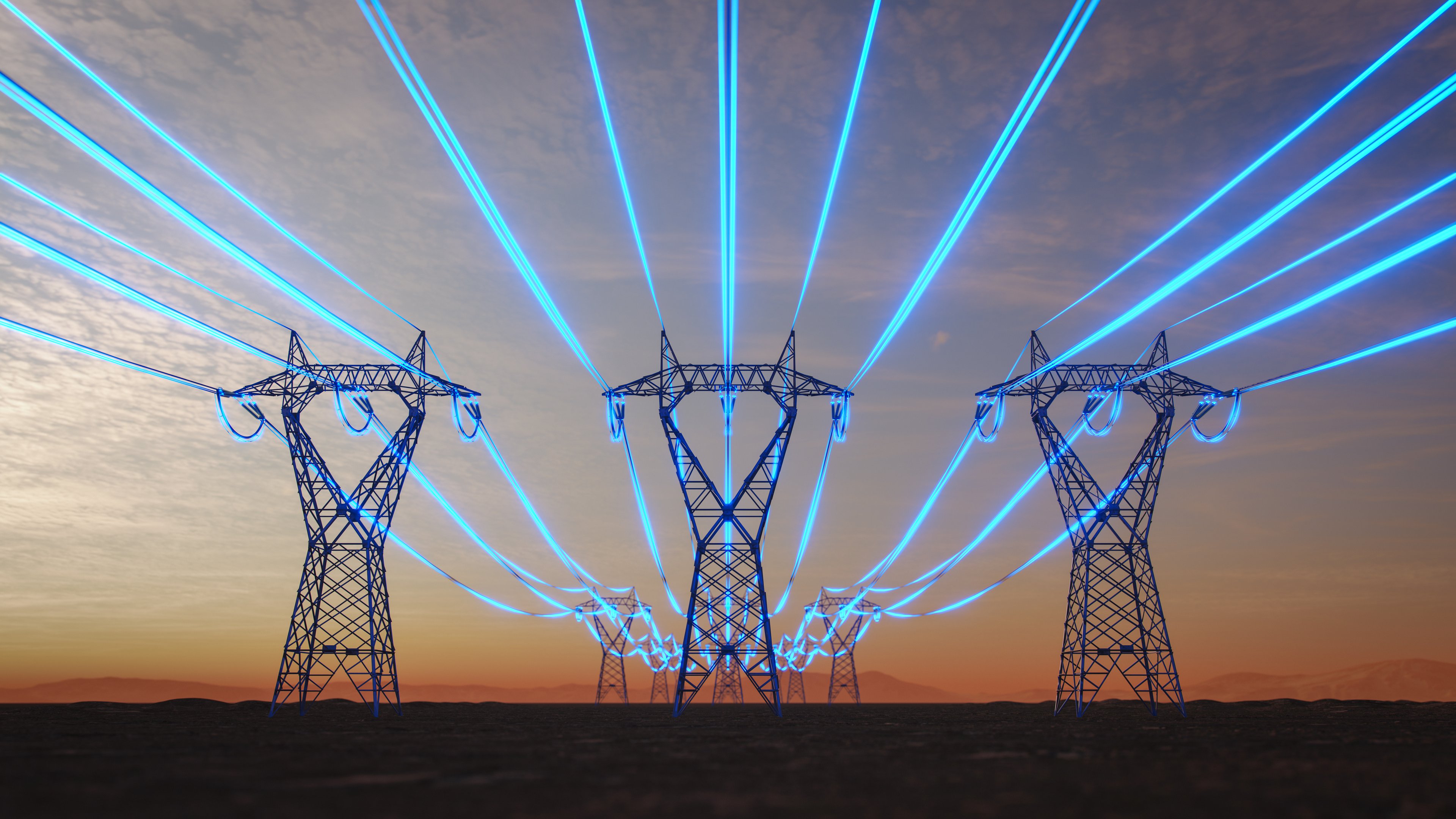 Electric transmission towers in a field.