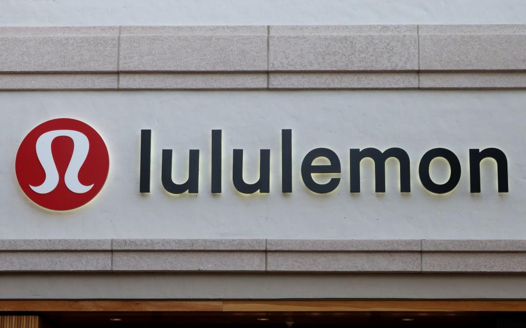 A lululemon logo and sign on the outside of a store.